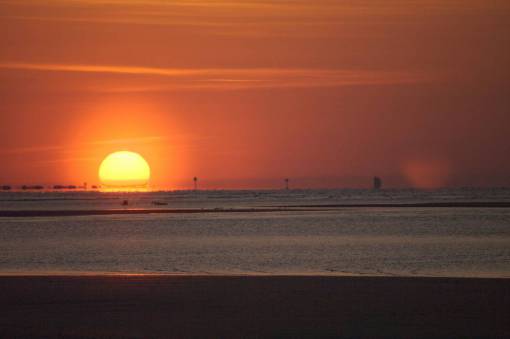 haze sunset  nuclear reactor  sun  beach  oak island  north carolina  north carolina beach