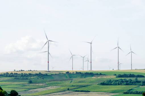 windmill windmill  structure  field  farm  trees  highland  green