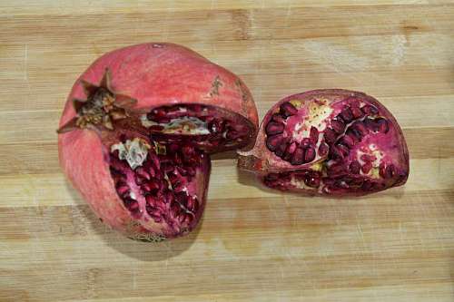 kernel pomegranate slice section cross produce fruit wooden wood
