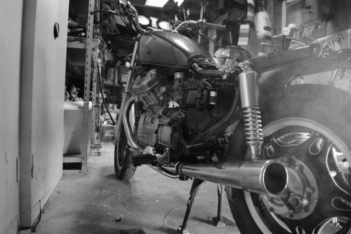 tank black and white  motorcycle  bike  park  door  engine  tires