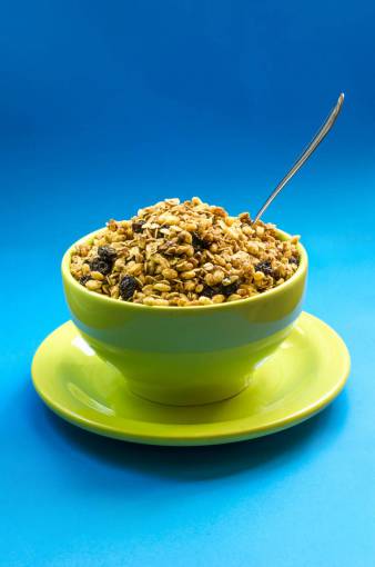 raised food  bowl  plate  green  spoon  raisins  peanut
