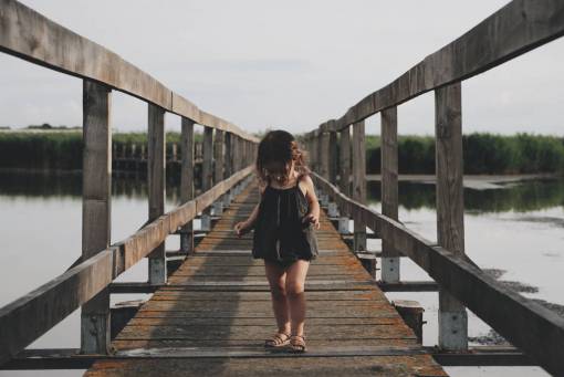 platform-shoe kid  chils  girl  walking  wooden  bridge  platform