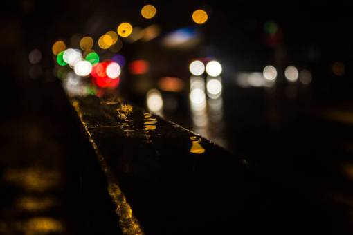 track bokeh  city  lights  tracks  road  car  red