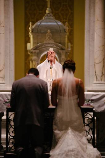 knees wedding  mass  priest  bride  groom  gown  suit