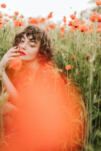 happy Woman in a poppy field
