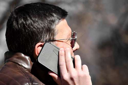 telecommunication phone ear hand profile side mobile telecommunication businessperson businessman telephone 