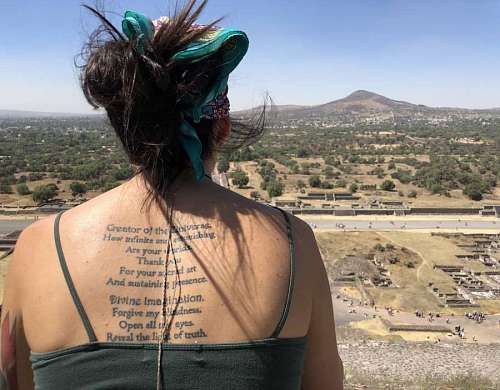 tattoo poetry desert sun wind hairstyle portrait skin woman kb