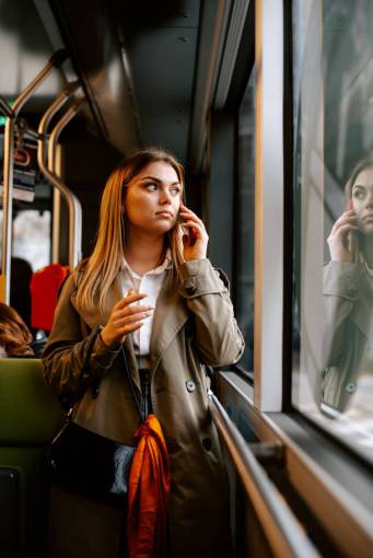 train mobile phone adult smart phone young adult women one person woman;train;Cell Phone