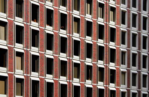 apartamento edificio de ladrillo patrón ciudad urbana ventanas fachada