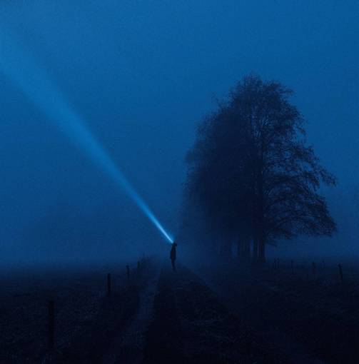 silhouette night countryside;man;lantern;mist dark silhouette nature fog outdoors