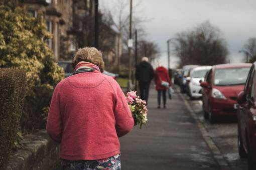 sidewalk people  old  woman  walking  flower  sidewalk  car