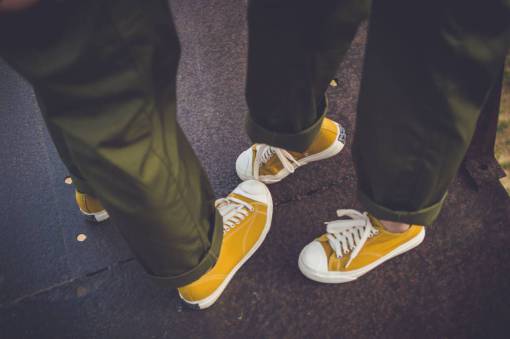 footwear yellow  shoe  footwear  pants  couple  people  travel
