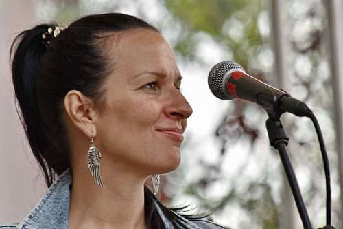 enjoying-life singing smiling pretty enjoying microphone woman portrait lifestyle