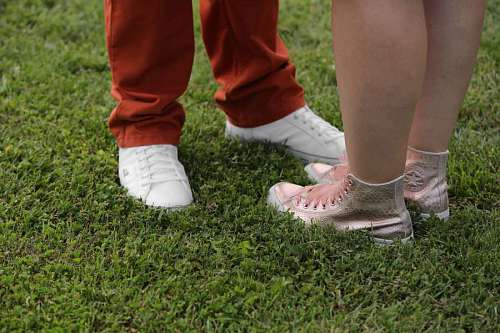 boyfriend sneakers grass boyfriend girlfriend pants footwear lawn shoe foot legs