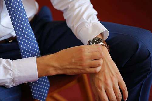 wristwatch wristwatch businessman hand indoors leisure hands business woman 