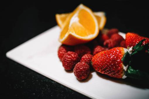 rasp orange  strawberry  raspberry  plate  fruit  food  dark