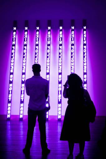 silhouette Couple in a contemporary art museum admiring the works