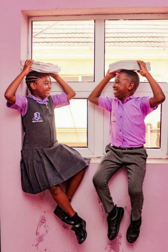 happy A girl and a boy returning to classes at school