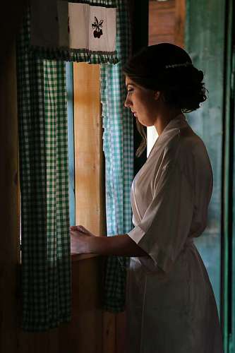 garment alone wait windows woman garment indoors window portrait 