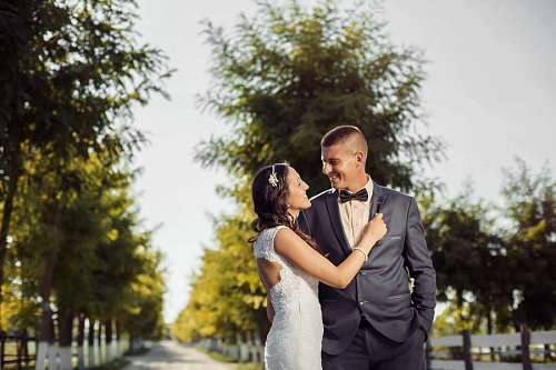 newlywed hugging happy walking newlyweds groom outdoors portrait person
