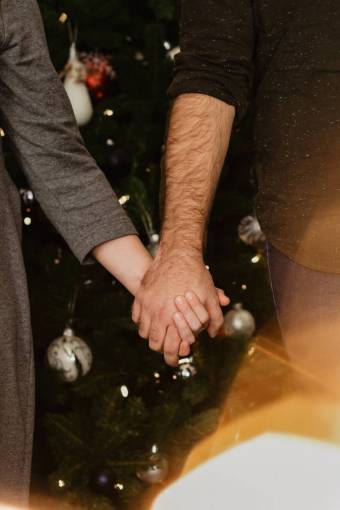 Couple holding hands at christmas