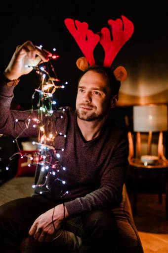 smiling Man holding christmas lights