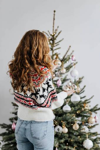 xmas Woman decorating christmas tree