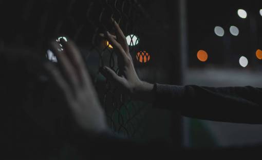 pushing hands  bokeh  fence  lights  night  dark  push
