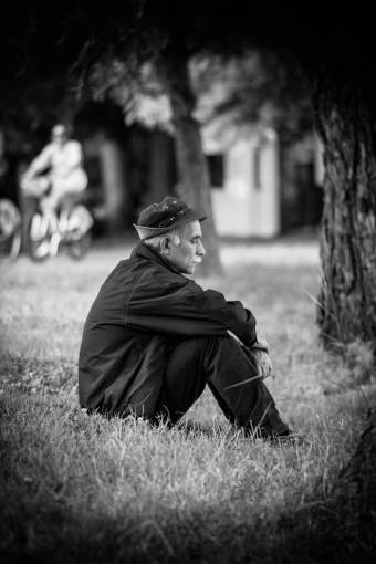 playground grass  people  old  man  sad  black and white  trees