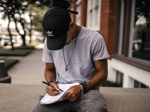 people  man  guy  black  cap  hat  notebook
