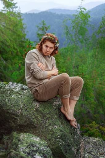 lifestyle Young man in the forest looking at a camera