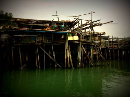 poor huts  village  river  wood  shacks  water  poor

