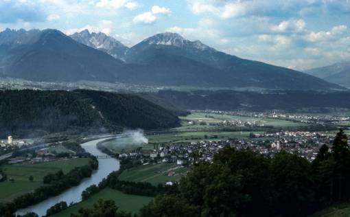 river  water  green  grass  trees  houses  village