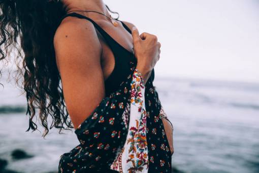 robe ocean  water  hair  sea  calm  person  coast