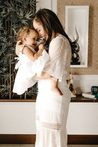 love Latin woman holding her baby