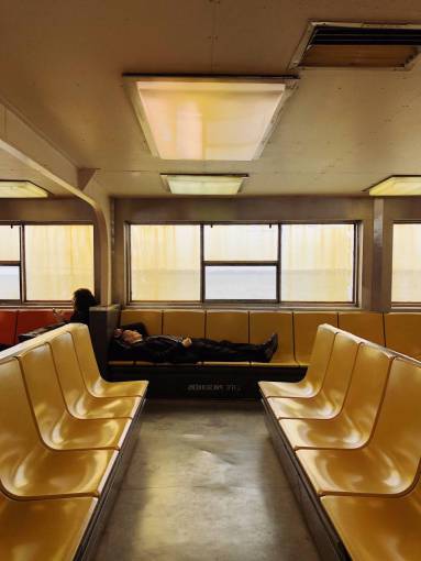 one-man-only Man sleeping in a waiting room during a trip