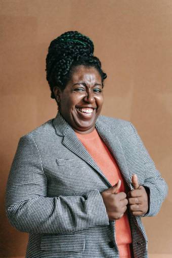 happy Portrait of a woman smiling with thumbs up