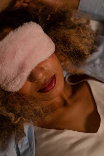 peaceful Woman sleeping with eye cover