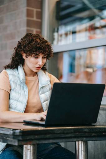 technology Woman working with her laptop in a cafe
