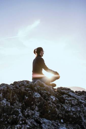 nature one person meditating healthy lifestyle outdoors woman;meditation;mountain;sunset yoga