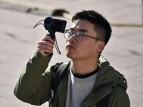 businessman photographer camera china face tourist attraction portrait
