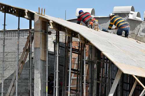 construction worker concrete industry architectural buildings architecture rooftop outdoors wooden building