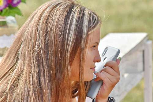 picnic-blanket mobile phone attractive face picnic think pretty kb