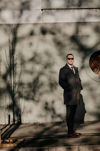 outfit standing outfit street confident jacket portrait couple person businessman tuxedo suit downtown sunglasses  town handsome