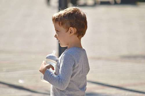 coordination water drinking child children needs special boy enjoyment happiness outdoors nature fun coordination relax helps improve therapy balance wet well