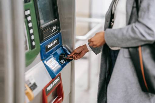 technology Woman withdrawing money from an ATM