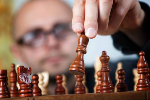 moving Man playing chess