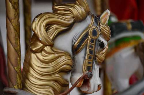 carousel-lights carousel horse mechanism ride antiquity glow colorful golden rust statue toy