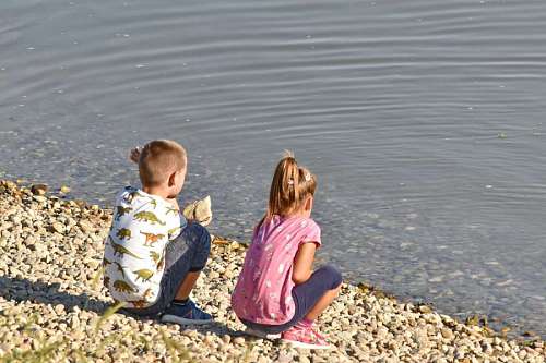 child happy children boy beach water fun togetherness