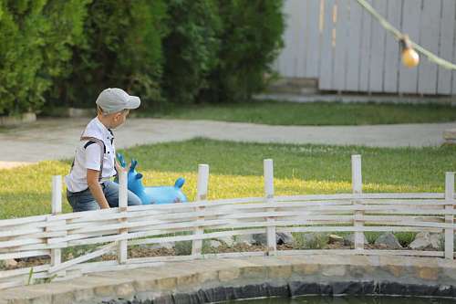 picket fence playful picket outdoors child boy leisure nature